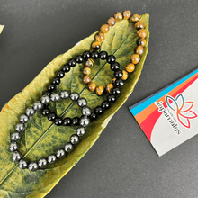 Carregar imagem no visualizador da galeria, 3 Pulseiras de Pedras Naturais Olho de Tigre, Onix e Hematita. Proporciona proteção, Aumenta Energia, Eleva a Segurança e Disciplina
