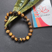 Carregar imagem no visualizador da galeria, Pulseira da Pedra Natural Olho de Tigre. Proporciona o Equilíbrio dos Chakras Inferiores e Ancora Energias Negativas