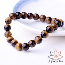 Carregar imagem no visualizador da galeria, Pulseira da Pedra Natural Olho de Tigre. Proporciona o Equilíbrio dos Chakras Inferiores e Ancora Energias Negativas